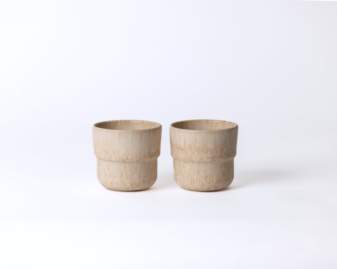 Zandkleurig keramisch koffiekopje Coral Clay van Mimo Homeware, rustig en minimalistisch design.